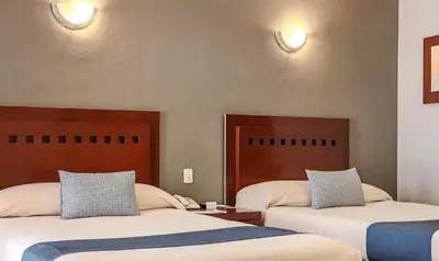 Cama o camas de una habitación en Hotel Panamerican