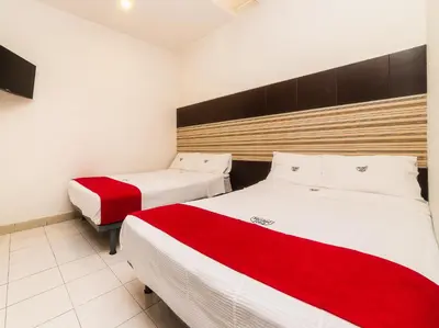 Cama o camas de una habitación en Hotel Río Puebla Centro