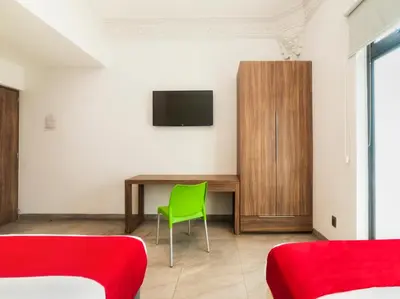 Una televisión o centro de entretenimiento en Hotel Río Puebla Centro