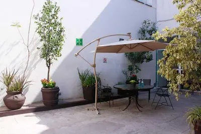 Un patio o zona al aire libre en Hotel Río Puebla Centro