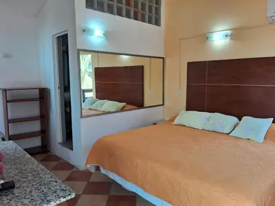 Cama o camas de una habitación en Hotel Villas del Rey