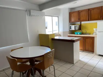 Una cocina o zona de cocina en Hotel Suites Regina