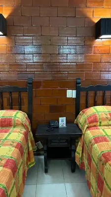 Cama o camas de una habitación en Hotel El Rancho