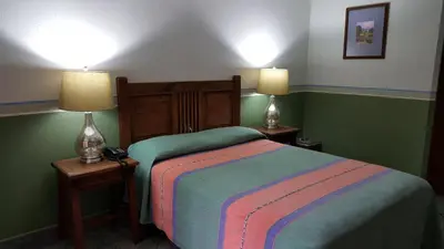 Cama o camas de una habitación en Hotel Posada San Jerónimo