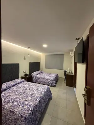 Cama o camas de una habitación en Hotel Impala Veracruz