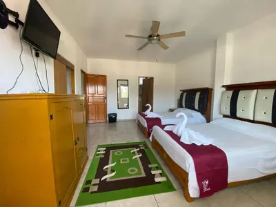 Cama o camas de una habitación en VILLA COSTERA HOTEL BOUTIQUE