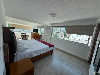 Cama o camas de una habitación en VILLA COSTERA HOTEL BOUTIQUE