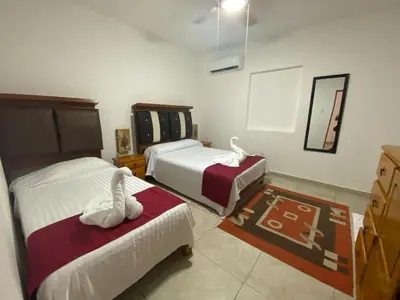 Cama o camas de una habitación en VILLA COSTERA HOTEL BOUTIQUE
