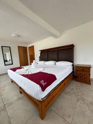 Cama o camas de una habitación en VILLA COSTERA HOTEL BOUTIQUE