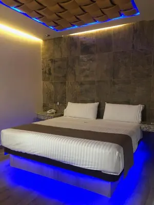 Cama o camas de una habitación en Hotel Jard Inn Adult Only