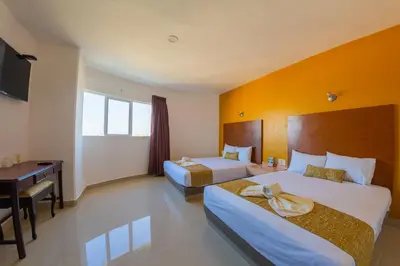 Cama o camas de una habitación en Hotel Maria del Rocio