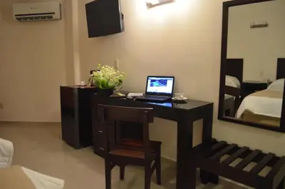 Una televisión o centro de entretenimiento en Hotel Mesón de la Chinantla