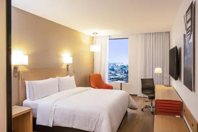 Cama o camas de una habitación en Fiesta Inn Parque Puebla