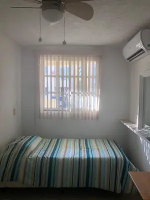 Cama o camas de una habitación en Renta de departamento en Acapulco Diamante
