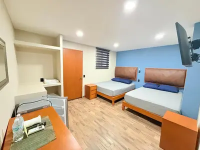 Cama o camas de una habitación en Hotel Casa-Noria Acapulco