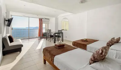 Cama o camas de una habitación en Suites Torres Gemelas VIP