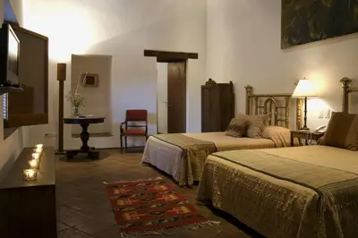 Cama o camas de una habitación en Hotel La Casona de Tita