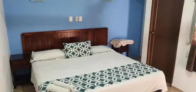 Cama o camas de una habitación en Hotel El Faro Malecon