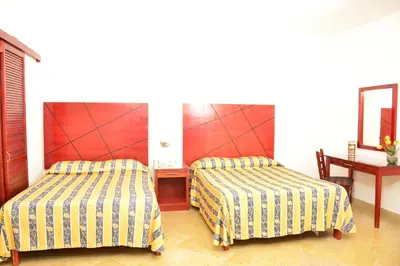 Cama o camas de una habitación en Hotel Paradise Inn