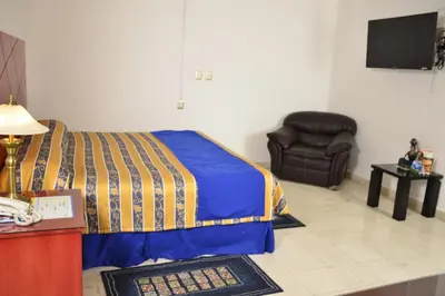 Cama o camas de una habitación en Hotel Paradise Inn