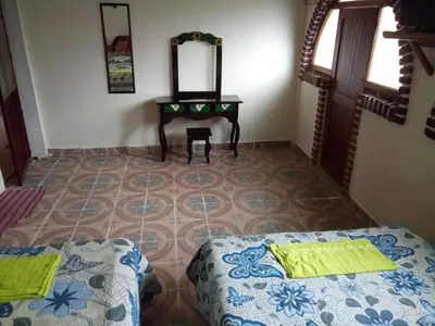 Cama o camas de una habitación en Hotel Cuaupatanini
