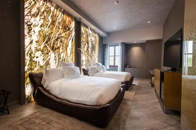 Cama o camas de una habitación en L Hotel Perla Boutique