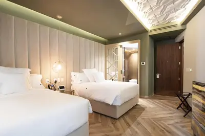 Cama o camas de una habitación en L Hotel Perla Boutique