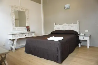 Cama o camas de una habitación en Hotel Palacio