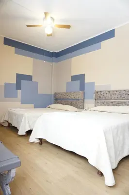 Cama o camas de una habitación en Hotel Palacio