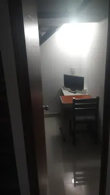 Una televisión o centro de entretenimiento en Division del Norte Rooms
