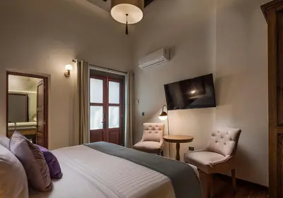 Cama o camas de una habitación en Hotel Casa Monarca