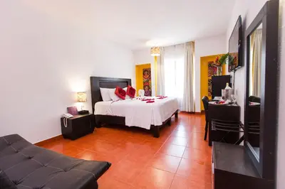 Cama o camas de una habitación en Hotel Santa Cruz Huatulco