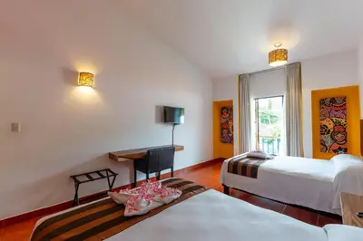 Cama o camas de una habitación en Hotel Santa Cruz Huatulco