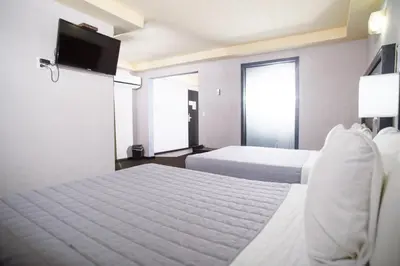 Cama o camas de una habitación en Hotel Ha