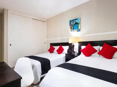 Cama o camas de una habitación en Boca Inn Hotel & Suites