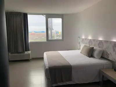 Cama o camas de una habitación en Hotel Punta Azul