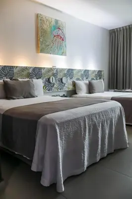 Cama o camas de una habitación en Hotel Punta Azul