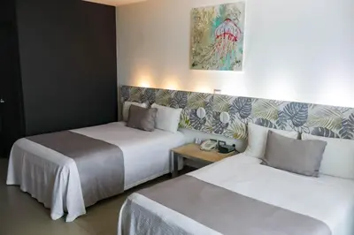 Cama o camas de una habitación en Hotel Punta Azul