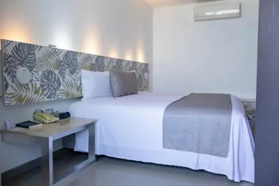 Cama o camas de una habitación en Hotel Punta Azul