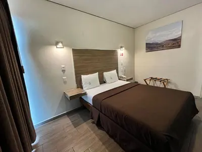 Cama o camas de una habitación en Hotel Guivá Aeropuerto