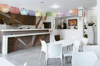 Una cocina o zona de cocina en Hotel Guivá Aeropuerto