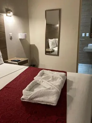 Cama o camas de una habitación en Hotel Guivá Aeropuerto
