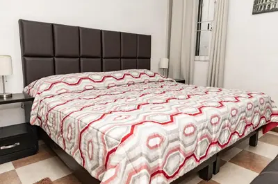 Cama o camas de una habitación en Hermoso departamento en Oaxaca con estacionamiento