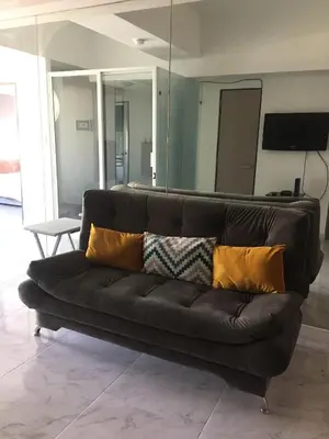 Una televisión o centro de entretenimiento en Blue Dreams Apartament Del Valle