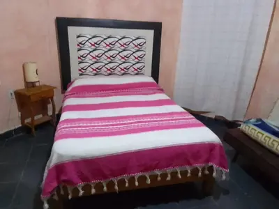 Cama o camas de una habitación en Hospedaje Casa Cortés - Recamaras de Descanso en Tepoztlán Mor