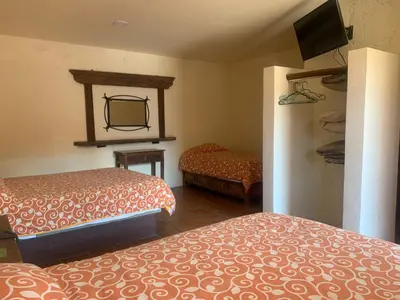 Cama o camas de una habitación en Hotel Posada Don Ramon
