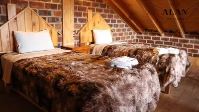 Cama o camas de una habitación en Hotel y Cabañas Alan