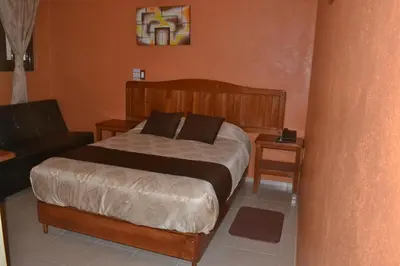 Cama o camas de una habitación en Hotel Márquez