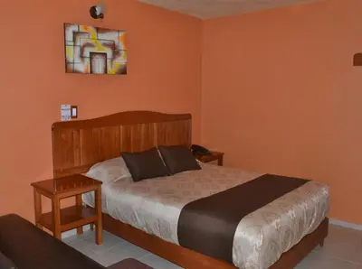 Cama o camas de una habitación en Hotel Márquez
