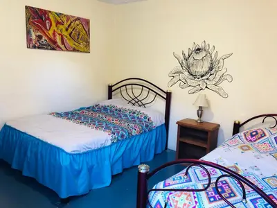 Cama o camas de una habitación en Los Nardos Hostel -pet friendly-